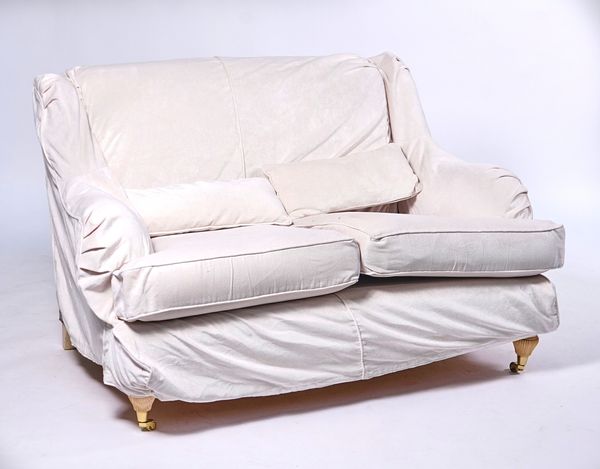 A MODERN TWO SEATER SOFA