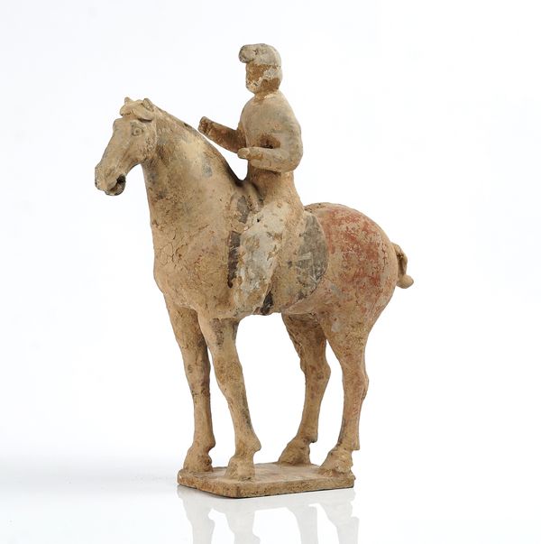 A CHINESE POTTERY EQUESTRIAN FIGURE
