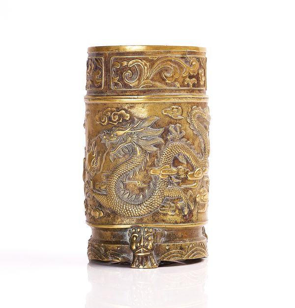 A CHINESE BRASS CYLINDRICAL BRUSH POT