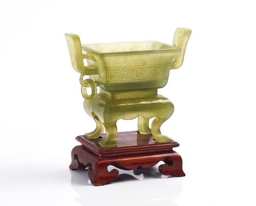 A CHINESE GREEN JADE TWO-HANDLED CENSER