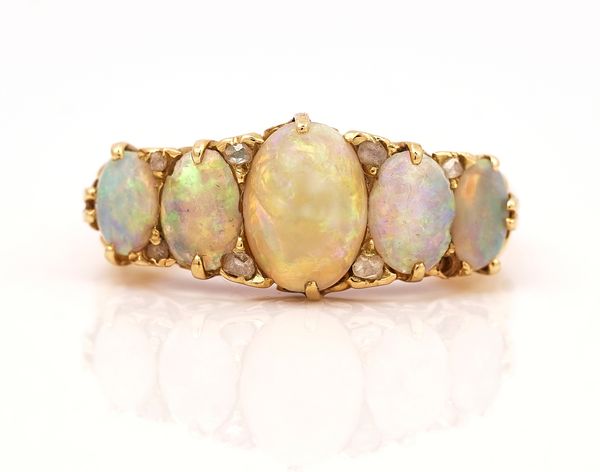 A GOLD, OPAL AND DIAMOND RING