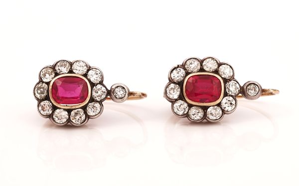 A PAIR OF DIAMOND AND SYNTHETIC RED SPINEL OVAL CLUSTER EARRINGS