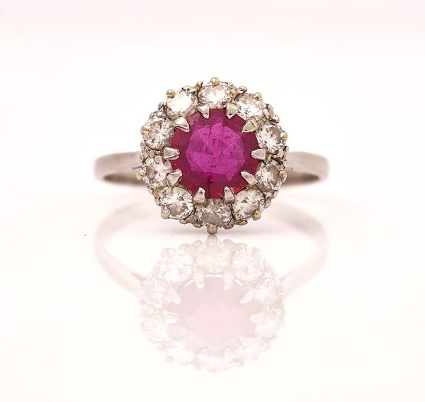 A PLATINUM, RUBY AND DIAMOND CLUSTER RING