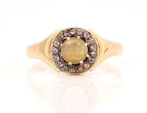 A GOLD, CHRYSOBERYL CAT'S EYE AND DIAMOND CLUSTER RING