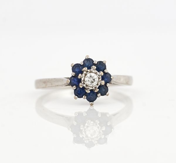 AN 18CT WHITE GOLD, SAPPHIRE AND DIAMOND CLUSTER RING