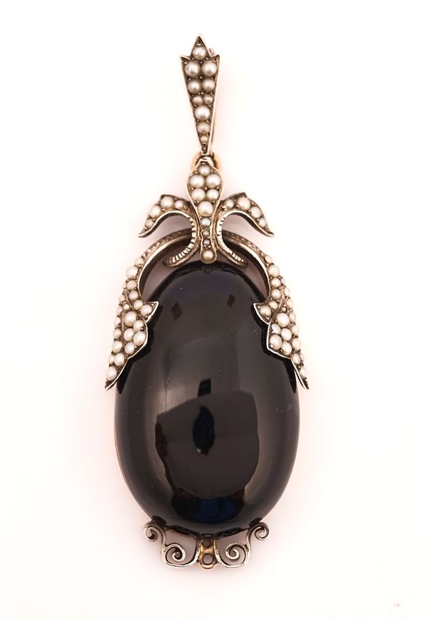 A LATE 19TH CENTURY BLACK ONYX AND SEED PEARL PENDANT