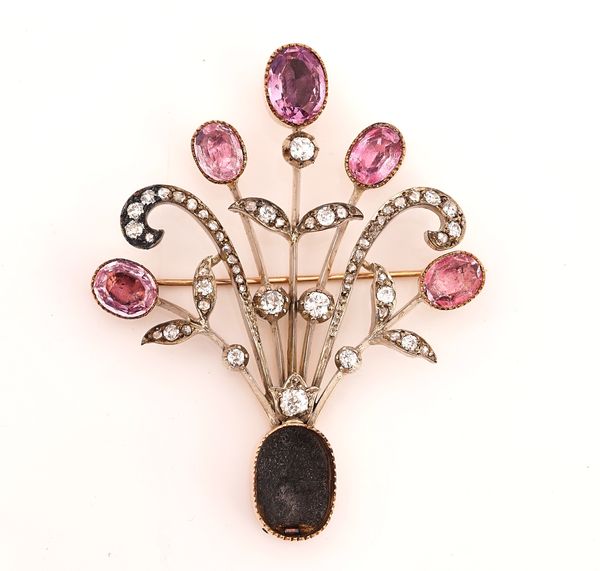 A VICTORIAN DIAMOND AND FOIL BACKED VARIOUS PINK GEMSTONE SET BROOCH