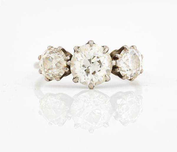 A DIAMOND SET THREE STONE RING