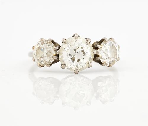 A DIAMOND SET THREE STONE RING