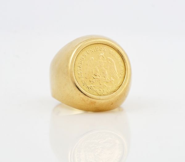 A GOLD RING MOUNTED WITH A MEXICO DOS PESOS 1945