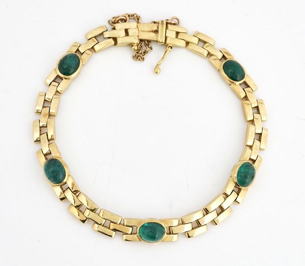 A GOLD AND CABOCHON EMERALD BRACELET