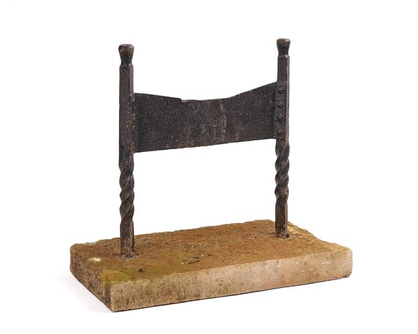 A BLACK PAINTED WROUGHT IRON BOOT SCRAPER