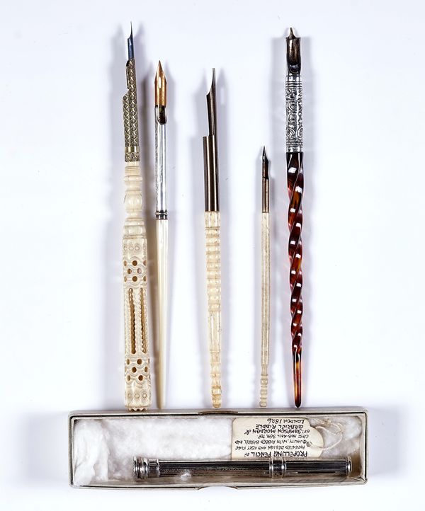 A GEORGE IV SILVER PROPELLING PENCIL AND FIVE QUILL PENS
