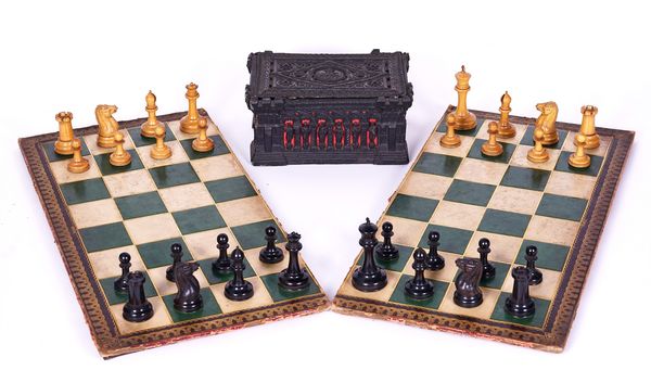 A VICTORIAN STAUNTON PATTERN  BOXWOOD AND EBONY CHESS SET WITH CARTON PIERRE CASKET AND MATCHING CHESSBOARD