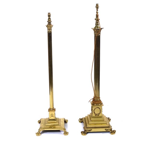 A LACQUERED BRASS HEIGHT ADJUSTABLE CORINTHIAN COLUMN STANDARD LAMP AND ANOTHER SIMILAR (2)