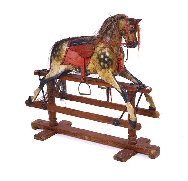 A PAINTED WOODEN ROCKING HORSE