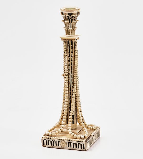 AN EUROPEAN IVORY MOUNTED CANDLESTICK