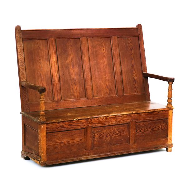 A 19TH CENTURY PITCH PINE BOX SEAT SETTLE