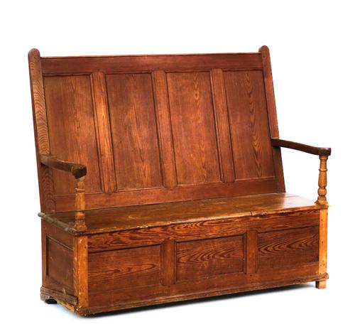 A 19TH CENTURY PITCH PINE BOX SEAT SETTLE