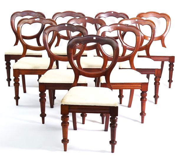 A SET OF TEN VICTORIAN WALNUT BALLOON BACK DINING CHAIRS