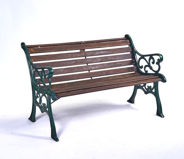 AN EARLY 20TH CENTURY GREEN PAINTED CAST IRON GARDEN BENCH