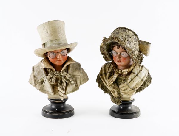 A PAIR OF EARLY 20TH CENTURY AUSTRIAN PAINTED TERRACOTTA NOVELTY BUSTS OF CHILDREN (2)