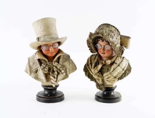 A PAIR OF EARLY 20TH CENTURY AUSTRIAN PAINTED TERRACOTTA NOVELTY BUSTS OF CHILDREN (2)