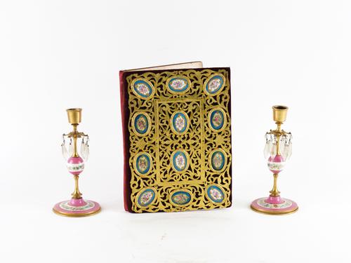 A PIERCED GILT-BRASS MOUNTED BLUE GROUND SEVRES STYLE PORCELAIN DESK BLOTTING PAD; TOGETHER WITH A PAIR OF CANDLESTICKS (3)