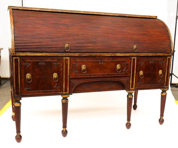 A LATE REGENCY MAHOGANY PARCEL-GILT SIDEBOARD WITH CYLINDER TAMBOUR SERVING TOP