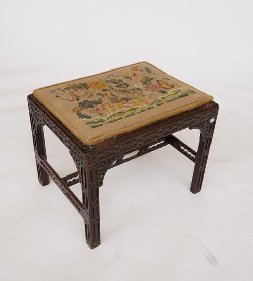 A GEORGE III AND LATER MAHOGANY BLIND FRET CARVED RECTANGULAR FOOT STOOL