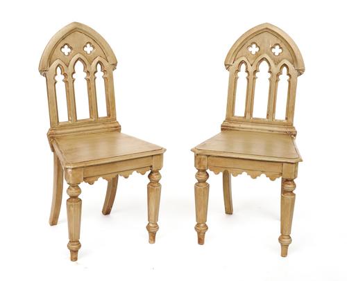 A PAIR OF GOTHIC REVIVAL PIERCED ARCHED BACK HALL CHAIRS (2)