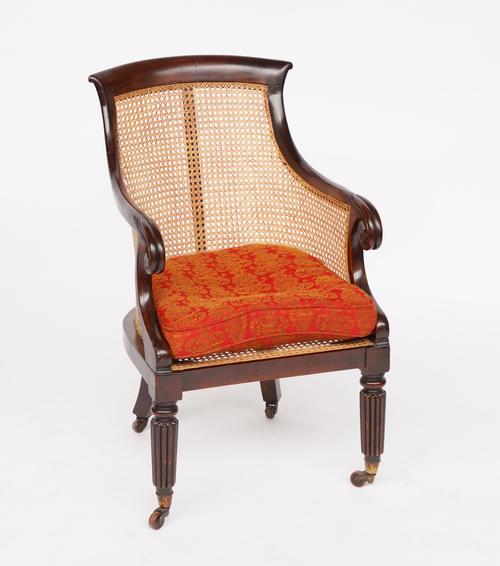 A WILLIAM IV MAHOGANY BERGERE CANEWORK LIBRARY CHAIR