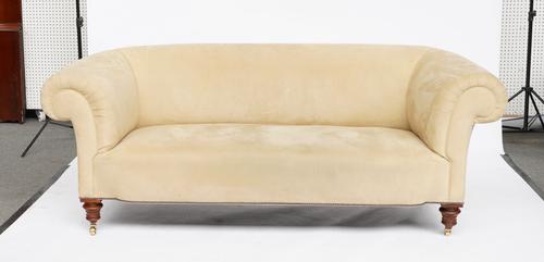 A VICTORIAN  BEIGE  SUEDE UPHOLSTERED CHESTERFIELD SOFA, ON TURNED WALNUT SUPPORTS