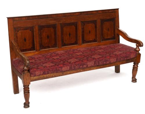 A GEORGE III MAHOGANY INALID OAK PANEL BACK OPEN ARM SETTLE