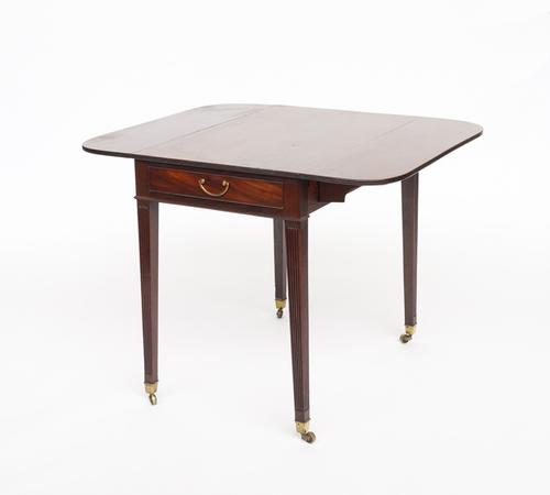 A GEORGE III MAHOGANY PEMBROKE TABLE ON CHANNELLED SQUARE SUPPORTS
