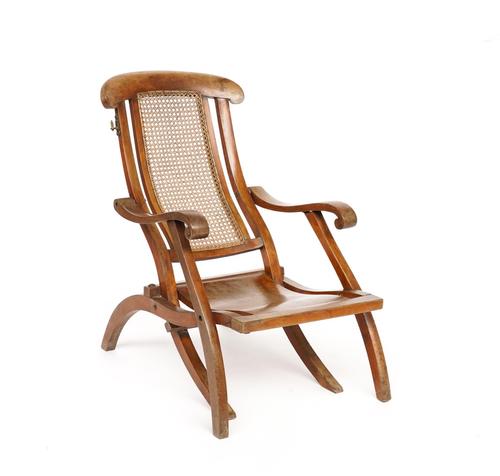 AN EDWARDIAN BEECH FOLDING STEAMER TYPE CHAIR
