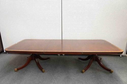 PROBABLY WILLIAM TILLMAN; A GEORGE III STYLE BURR WOOD BANDED AND WALNUT CROSSBANDED MAHOGANY TWIN PILLAR EXTENDING DINING TABLE