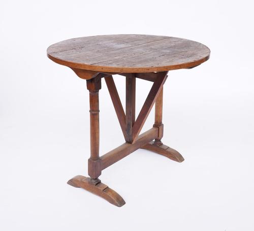 A SMALL19TH CENTURY FRENCH FRUITWOOD CIRCULAR WINE TASTING TABLE