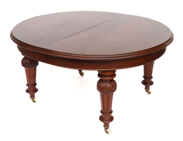 A VICTORIAN MAHOGANY OVAL EXTENDING DINING TABLE