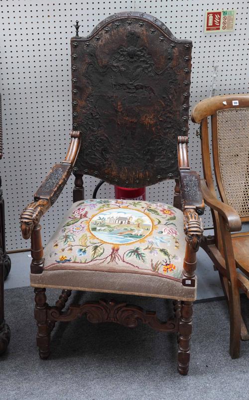 A 17TH CENTURY FLEMISH STYLE EMBOSSED LEATHER CARVED MAHOGANY FRAMED OPEN ARMCHAIR