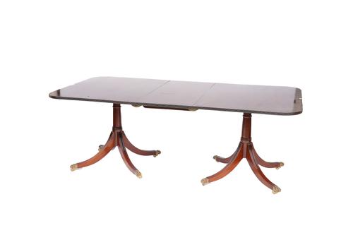 MILLWOOD CABINET MAKING; A REGENCY STYLE MAHOGANY TWIN PILLAR EXTENDING DINING TABLE