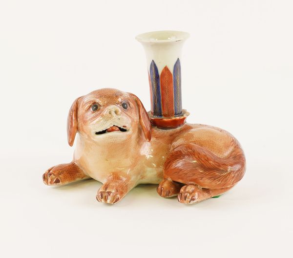 A CHINESE EXPORT PORCELAIN LAP DOG CANDLE HOLDER