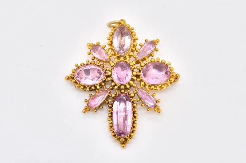 A GOLD AND FOIL BACKED PINK TOPAZ PENDANT/BROOCH