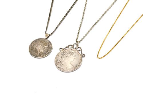 A GOLD NECKCHAIN AND TWO COIN PENDANTS WITH CHAINS