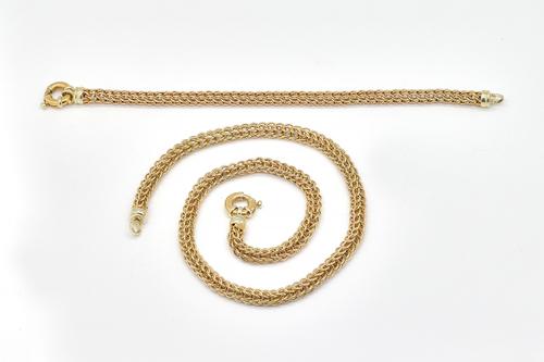 A 9CT GOLD NECKLACE AND A MATCHING BRACELET (2)