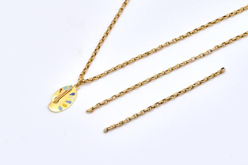 A GOLD LONG GUARD CHAIN AND A PENDANT (4)