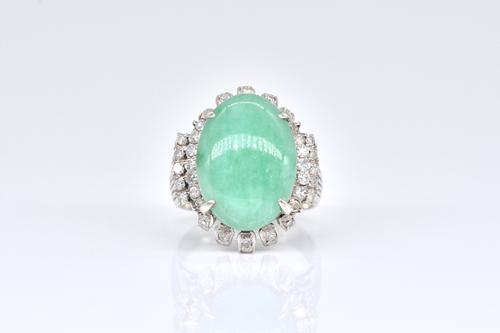 A PLATINUM, JADE AND DIAMOND RING