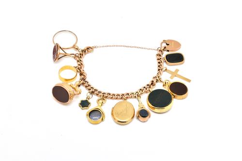 A GOLD CURB LINK CHARM BRACELET