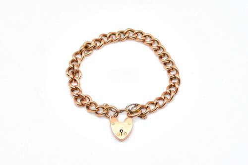 A 9CT GOLD CURB LINK BRACELET