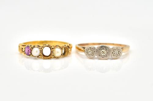 A GOLD AND DIAMOND THREE STONE RING AND ANOTHER RING (2)